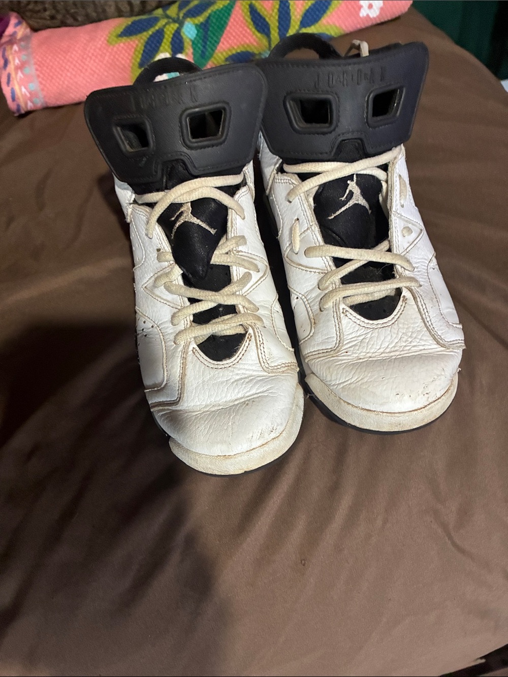 Jordan women’s White and Black High-Top Sneakers